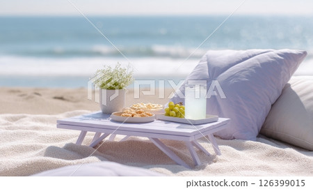 Youth enjoy a mindful summer picnic on the beach with vegan snacks, drinks, and an ocean backdrop Youth enjoy a mindful summer picnic on the beach with vegan snacks, drinks, and an ocean backdrop 126399015