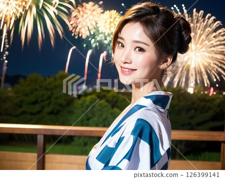 A woman in a yukata enjoying fireworks 126399141
