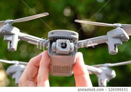 Drone in hand (stock photo) 126399331
