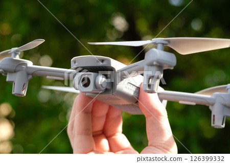 Drone in hand (stock photo) 126399332