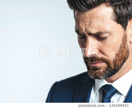 A sad man in a suit 126399431