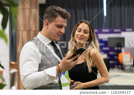 Professional Interaction at a Business Event Capturing Confidence and Engagement. 126399517