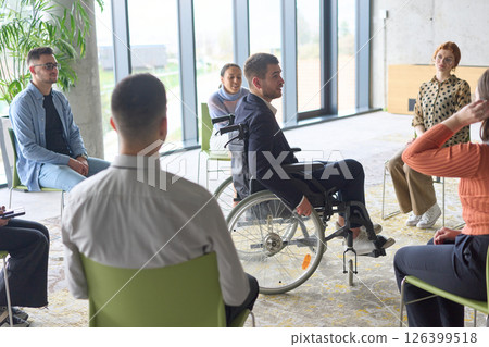 Corporate business team meeting with a manager or coach. Group of happy diverse, multiracial people sitting in a circle  126399518