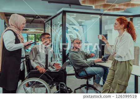 Young group of business people brainstorming together in a startup space, discussing business projects, investments, and solving challenges. 126399519