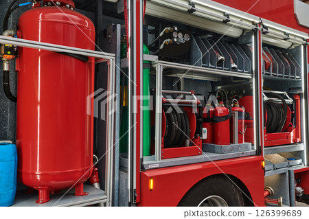 Close-up of essential firefighting equipment on a modern firetruck, showcasing tools and gear ready for emergency response to hazardous fire situations Close-up of essential firefighting equipment on a modern firetruck, showcasing tools and gear ready for emergency response to hazardous fire situations 126399689