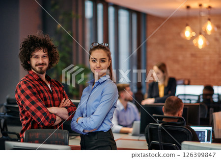Corporate Collaboration: European Blonde Businesswoman and Colleague Standing in Modern Office 126399847