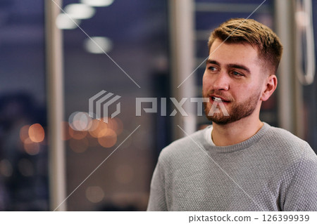 Close-up European Businessman Engaging with Colleagues in Office Discussion Close-up European Businessman Engaging with Colleagues in Office Discussion 126399939