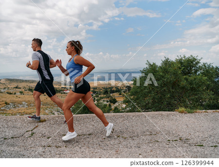 Mountain Bliss: Capturing the Joy of Morning Trail Running 126399944