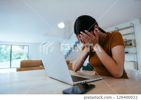 Woman sitting in living room using laptop looking at cam talk by video call with business friend relatives, head shot. Job interview answering questions 126400022
