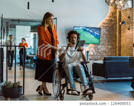 African-American businessman in a wheelchair engages in a collaborative discussion, using a tablet, with his business colleague, exemplifying the seamless integration of adaptive technology and African-American businessman in a wheelchair engages in a collaborative discussion, using a tablet, with his business colleague, exemplifying the seamless integration of adaptive technology and 126400051