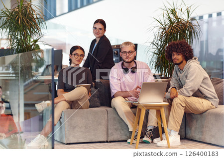 In a modern startup office, a diverse group of young professionals collaboratively tackles various business problems and challenges, surrounded by their engaged colleagues, fostering innovation and 126400183