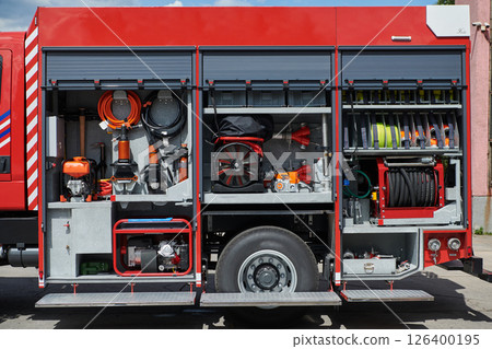 Close-up of essential firefighting equipment on a modern firetruck, showcasing tools and gear ready for emergency response to hazardous fire situations 126400195