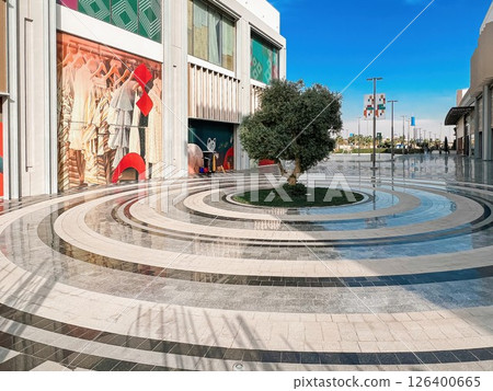Modern Outdoor Retail Space with Tree Centerpiece in Riyadh 126400665