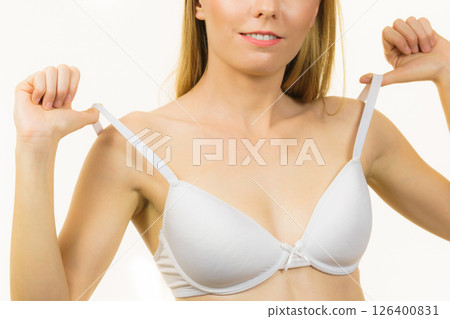 Young woman holding bra strap 126400831
