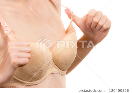 Woman wearing too big bra 126400836