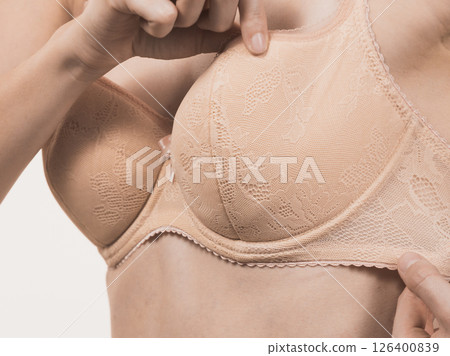 Female wearing too big bra, wrong size 126400839