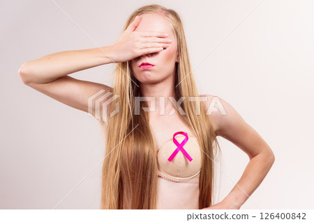 Woman pink cancer ribbon on breast 126400842