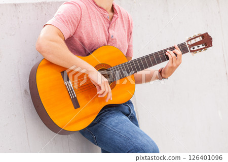 Person playing on guitar. Person playing on guitar. 126401096