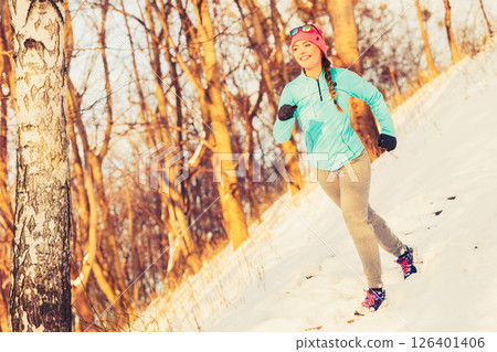 Woman doing winter jog in morning 126401406
