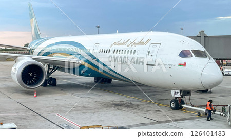 Oman Airlines Boeing 787 preparing for departure at Dubai Airport Oman Airlines Boeing 787 preparing for departure at Dubai Airport 126401483