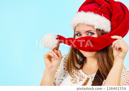 Happy woman in christmas santa hat 126401559