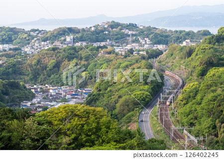 [Tokaido Main Line] Sunrise Seto and Izumo trains running through the mountains 126402245
