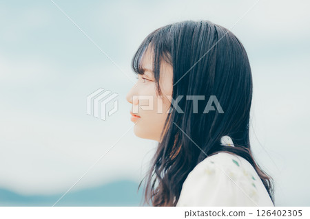 Close-up of a woman with a gentle gaze Close-up of a woman with a gentle gaze 126402305