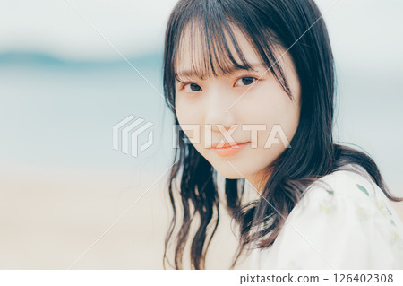 Close-up of a woman with a gentle gaze 126402308
