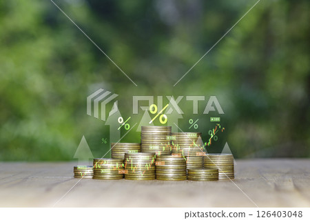 Coins are laid out in graph. Stack of the gold coin with a funding that grows. growing of business investment. growing power of compound interest concept. Business success wealth stock investment. 126403048