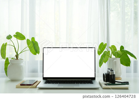 Laptop with white screen and tech, cozy indoor work space 126404728