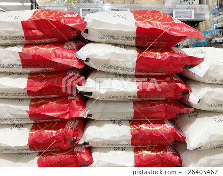 Rice bags stacked in front of a store, Rice bags Rice bags stacked in front of a store, Rice bags 126405467