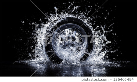 高性能輪胎在黑色背景下濺水的攝影棚照片 126405494