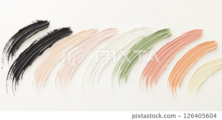 Brush strokes of various foundation shades on white background 126405604