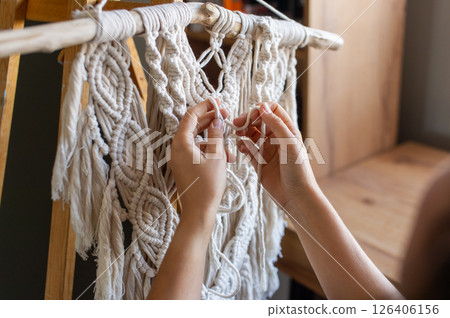 Crafting a Macrame Wall Hanging with Artistic Hands Crafting a Macrame Wall Hanging with Artistic Hands 126406156
