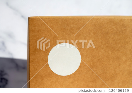Brown Paper Package with Blank White Label Brown Paper Package with Blank White Label 126406159