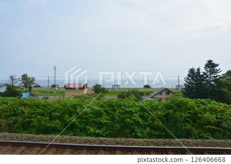 JR Hokkaido, Muroran Main Line, local train window view from Rebun Station to Toya Station (cloudy sky in summer 2023) JR Hokkaido, Muroran Main Line, local train window view from Rebun Station to Toya Station (cloudy sky in summer 2023) 126406668
