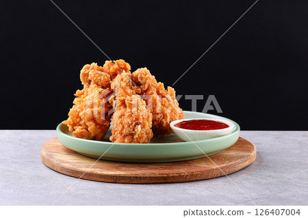 Crispy Fried Chicken Drumsticks with Sweet Chili Dip on Green Plate 126407004
