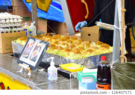 Okonomiyaki at a stall Okonomiyaki at a stall 126407571