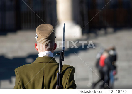 Hungarian soldier guarding in Budapest with a bayoneted rifle on his shoulder 126407701