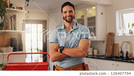 Plumber, arms crossed and portrait of man in kitchen for maintenance, house renovation and drainage repairman. Handyman, toolbox and pipe inspection with person in home for diy, labor and upgrade 126407794