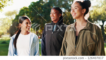 Laughing, women or athlete friends in park on break in outdoor training, workout or support in morning. Funny girls, confidence or happy people with smile for fitness, teamwork or exercise in nature 126407817