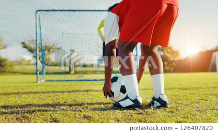 Playing, soccer and preparing for kick, children and player with skills for game, talent and cardio. Outdoor, football and kids with sportswear for match, growth and development of youth or fitness Playing, soccer and preparing for kick, children and player with skills for game, talent and cardio. Outdoor, football and kids with sportswear for match, growth and development of youth or fitness 126407820