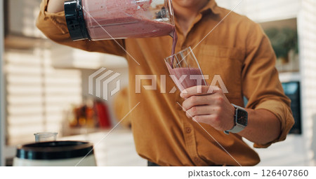 Hands, smoothie and man in kitchen, blender and nutrition with wellness, fruit drink and gut health. Benefits, closeup and person with organic ingredients, detox and weight loss with vitamins or home Hands, smoothie and man in kitchen, blender and nutrition with wellness, fruit drink and gut health. Benefits, closeup and person with organic ingredients, detox and weight loss with vitamins or home 126407860