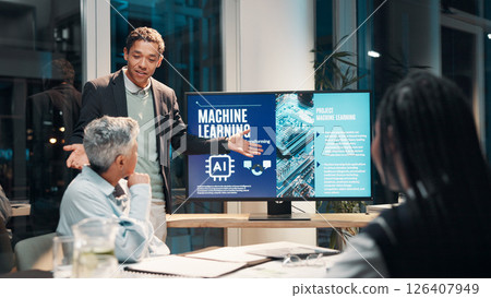 Businessman, screen and presentation in meeting for ai, machine learning or training in workshop office. Monitor, talk and team speaker with future technology for project development or idea at night Businessman, screen and presentation in meeting for ai, machine learning or training in workshop office. Monitor, talk and team speaker with future technology for project development or idea at night 126407949