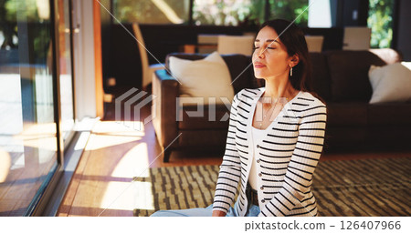 Relax, breathing and woman in living room in home with meditation, calm or peaceful morning. Mindfulness, spiritual and female person with on floor in lounge for wellness, health or zen in house. 126407966