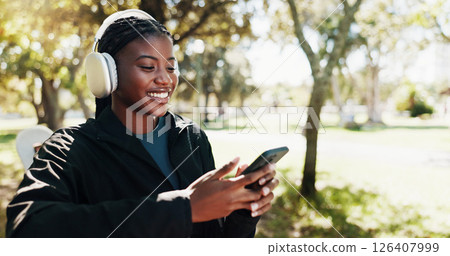 Outdoor, fitness and woman with smartphone, browsing and tracking progress of exercise on app and smile. Happy, athlete and black person with mobile for social media, headphones or listening to music Outdoor, fitness and woman with smartphone, browsing and tracking progress of exercise on app and smile. Happy, athlete and black person with mobile for social media, headphones or listening to music 126407999