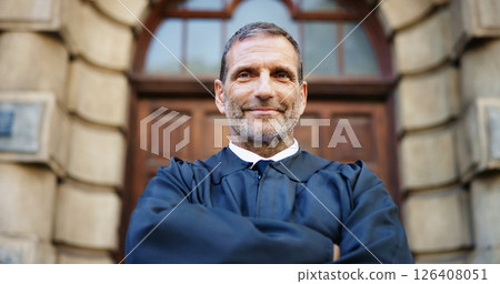 Portrait, man and judge with confidence in city for career pride, urban justice and court recess. Mature magistrate, arms crossed and authority of hearing verdict, trial process and procedure of case Portrait, man and judge with confidence in city for career pride, urban justice and court recess. Mature magistrate, arms crossed and authority of hearing verdict, trial process and procedure of case 126408051