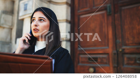 Phone call, lawyer and woman in city, conversation and documents with legal aid service. Outdoor, employee and attorney with smartphone, discussion and folder for court case, talking and negotiation Phone call, lawyer and woman in city, conversation and documents with legal aid service. Outdoor, employee and attorney with smartphone, discussion and folder for court case, talking and negotiation 126408058