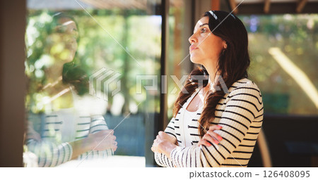 Home, thinking and woman by window with arms crossed, serious decision or daydreaming. Self reflection, deep thoughts and pensive person in house with mindset, vision and remember memory with view Home, thinking and woman by window with arms crossed, serious decision or daydreaming. Self reflection, deep thoughts and pensive person in house with mindset, vision and remember memory with view 126408095