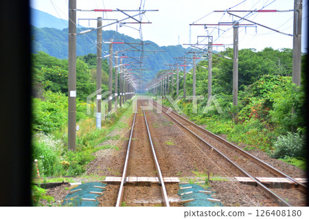 JR Hokkaido, Muroran Main Line, local train window view from Higashimuroran Station to Noboribetsu Station (cloudy sky in summer 2023) 126408180